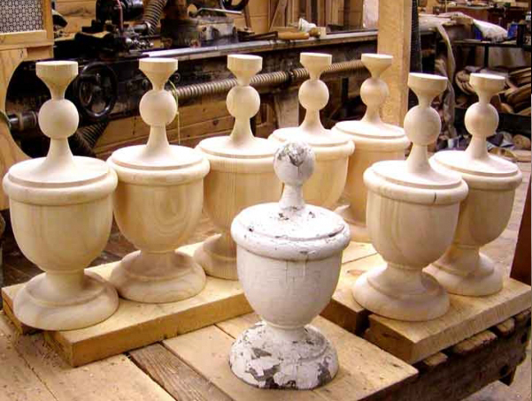 Grouping of unfinished wood finials that were custom made to match a customer sample.
